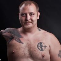 The Man With The Dolphin Stump Tattoo [PHOTO]