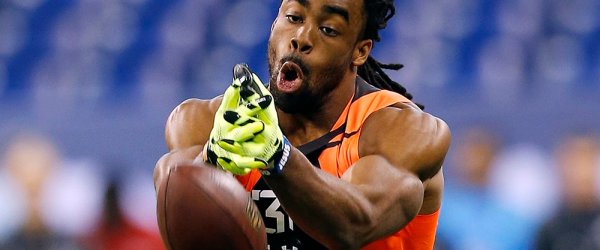 Connecticut wide receiver Geremy Davis drops a pass at the NFL football scouting combine in Indianapolis, Saturday, Feb. 21, 2015. (AP Photo/Julio Cortez)